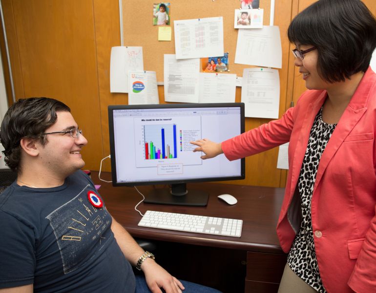 020541.jpg Xiang Bi (right) consulting with a graduate student.  Photo taken 10-24-16.