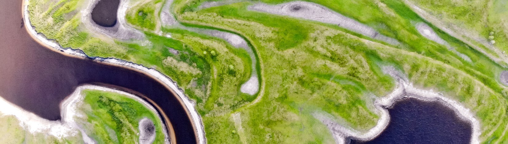 an aerial image of wetlands and streams