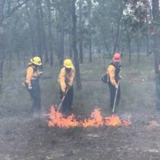 Small group of participants performing a practice prescribed burn