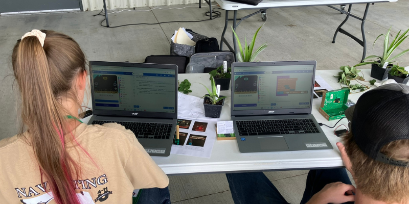 Students working on coding and technology activities during a NextGen AgTech Innovators hands-on workshop.